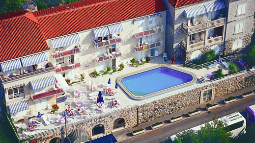 Aerial view of hotel with outside pool